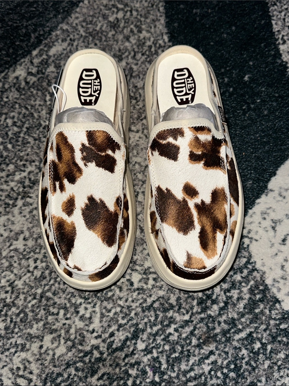 Hey Dude Women's Slip-On Mules in Brown and White Cowprint